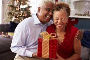 Couple with Gift - Medicare Supplement Colorado